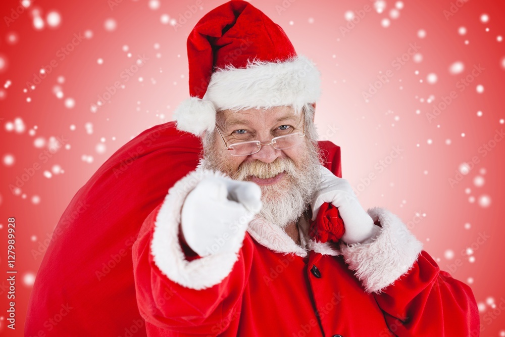 Composite image of close-up portrait of santa claus pointing Composite image of close-up portrait of santa claus pointing