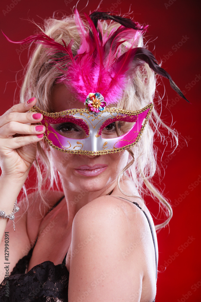 Fototapeta premium Attractive woman wearing carnival mask.