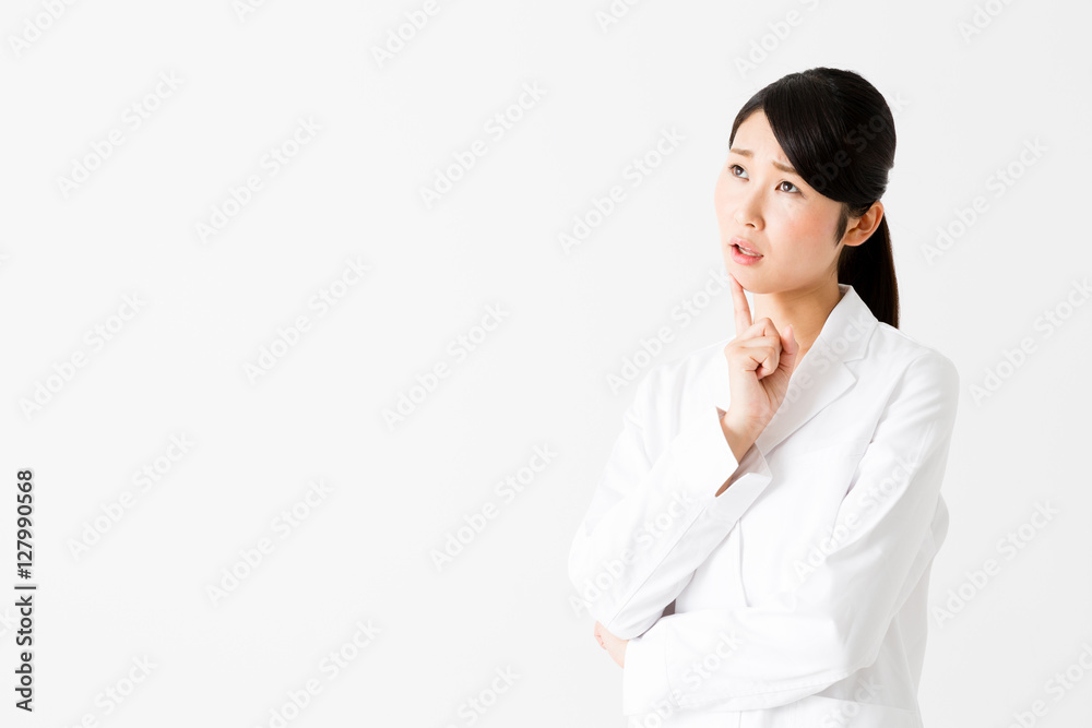 portrait of young asian doctor thinking isolated on white background portrait of young asian doctor thinking isolated on white background