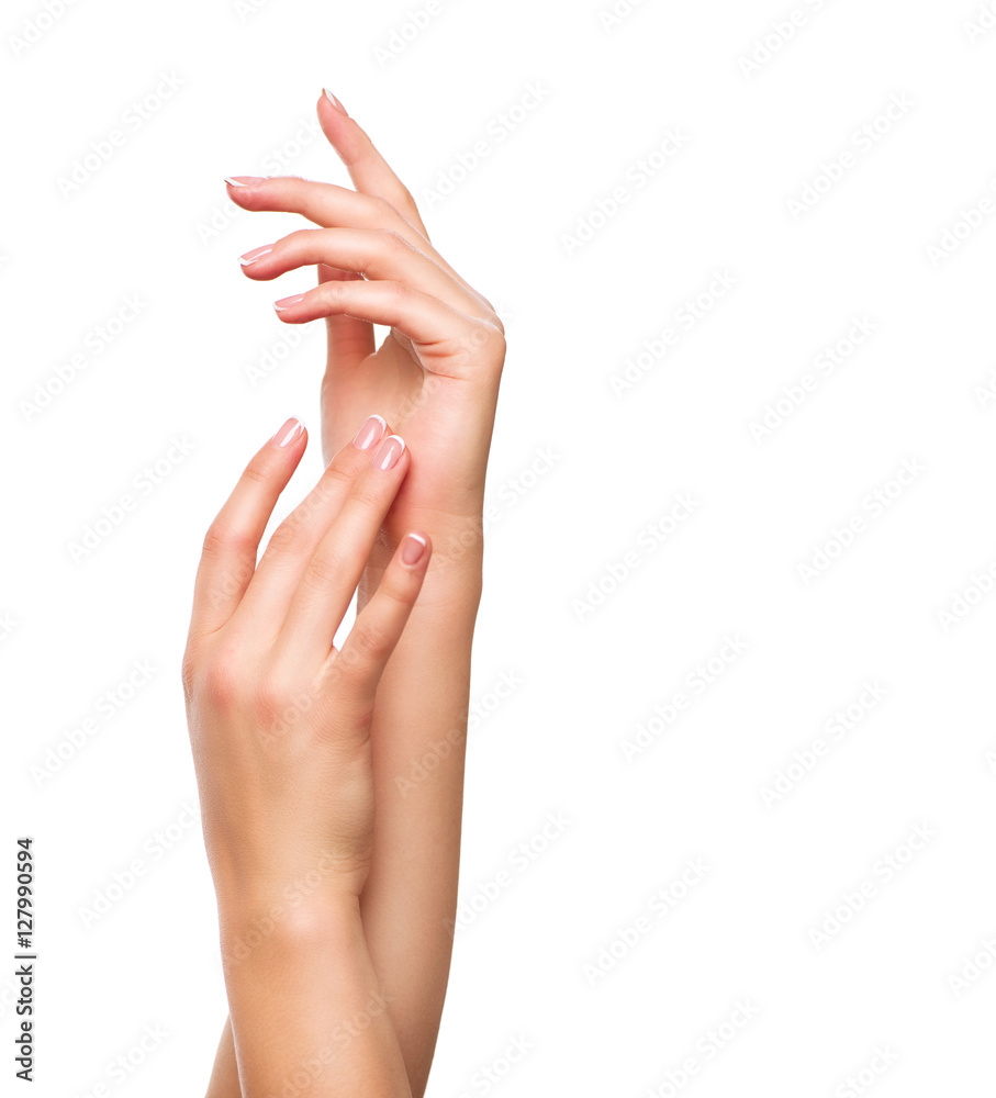 Beautiful woman hands. Spa and manicure concept. Female hands with french manicure Beautiful woman hands. Spa and manicure concept. Female hands with french manicure