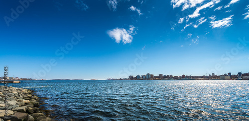 Halifax, Nova Scotia seen across Halifax Harbour from Dartmouth under a deep blue sky
