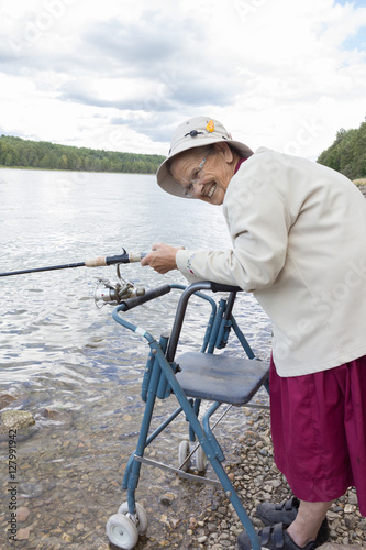 elderly woman with a fishing pole