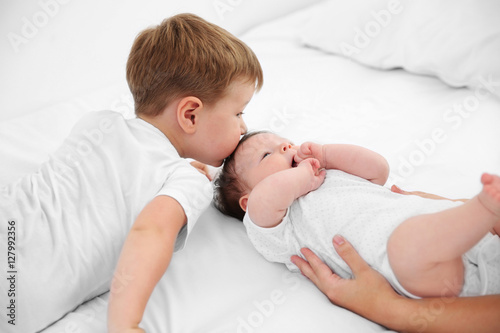 Small brother and sister on...