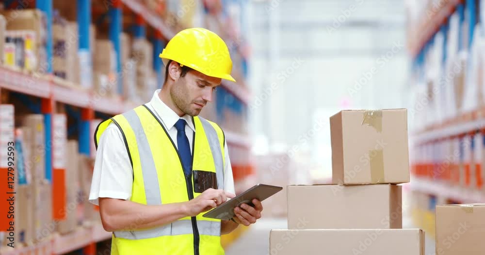 Male warehouse worker using digital tablet Male warehouse worker using digital tablet