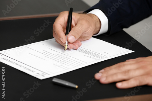 Картината върху платно Man signing power of attorney, closeup