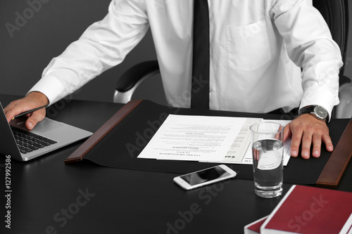 Man working with laptop in ...