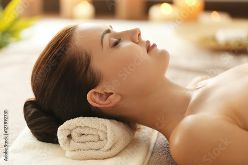 Attractive woman relaxing in spa salon