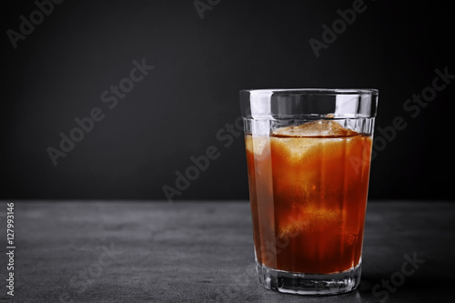 Iced coffee on grey background