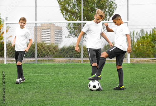 Boys playing football at st...