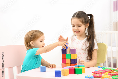 Cute girl playing with litt...