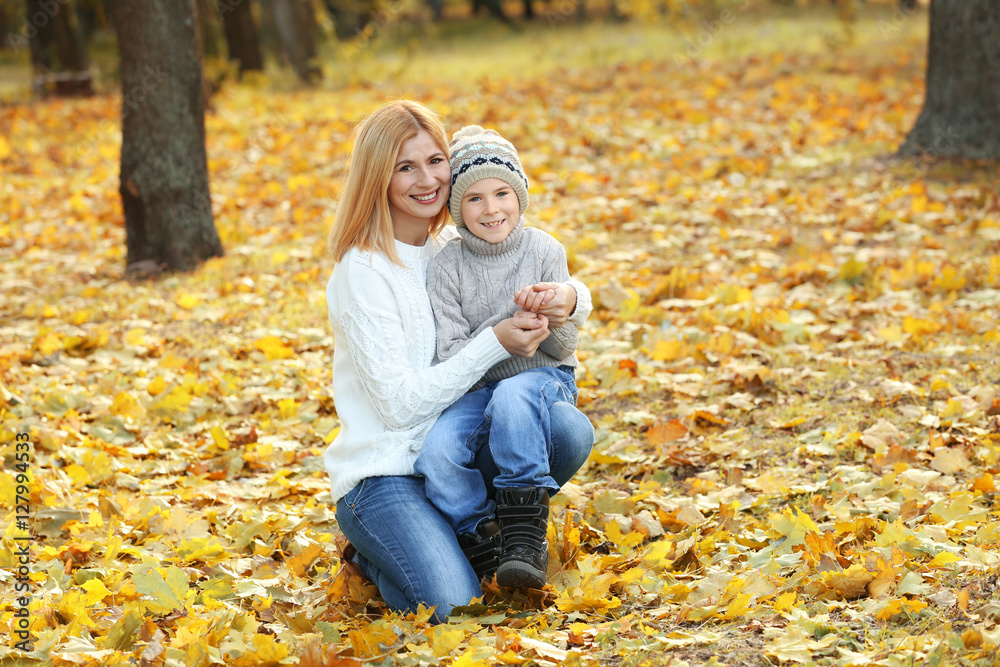 Mother and son in beautiful autumn park Mother and son in beautiful autumn park