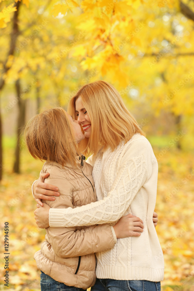 Mother and daughter in beautiful autumn park Mother and daughter in beautiful autumn park