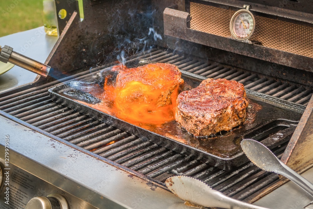 Sous Vide Steak Sous Vide Steak being flame seared with a handheld