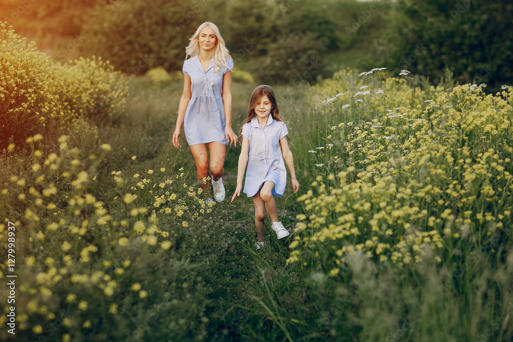 Fototapeta premium mom and daughter outside