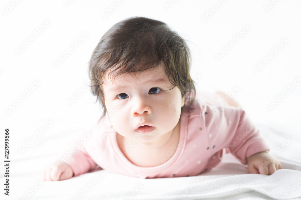 newborn baby girl in pink dress on white background newborn baby girl in pink dress on white background