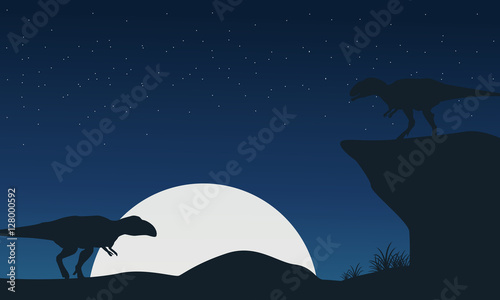 Landscape of mapusaurus dinosaur silhouettes