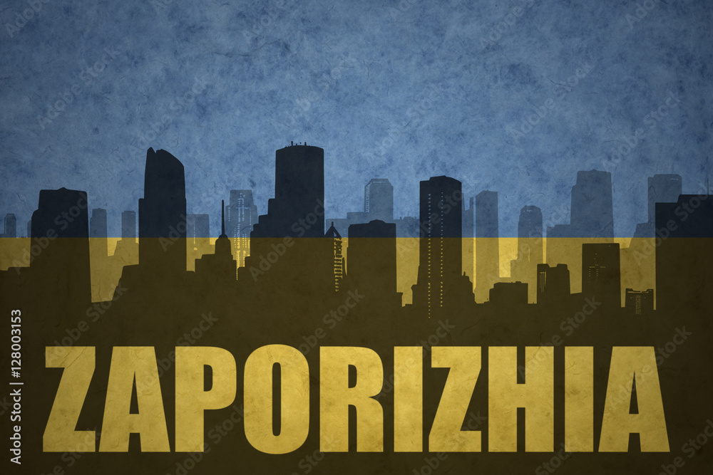 abstract silhouette of the city with text Zaporizhia at the vintage ukrainian flag