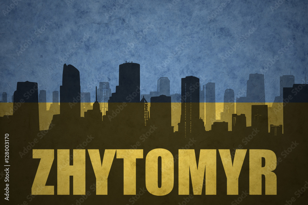 abstract silhouette of the city with text Zhytomyr at the vintage ukrainian flag