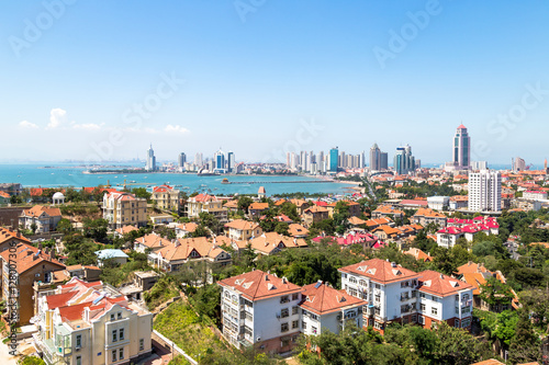 View of Old town and Qingdao bay from the hill of XiaoYuShan Park, Qingdao, China.