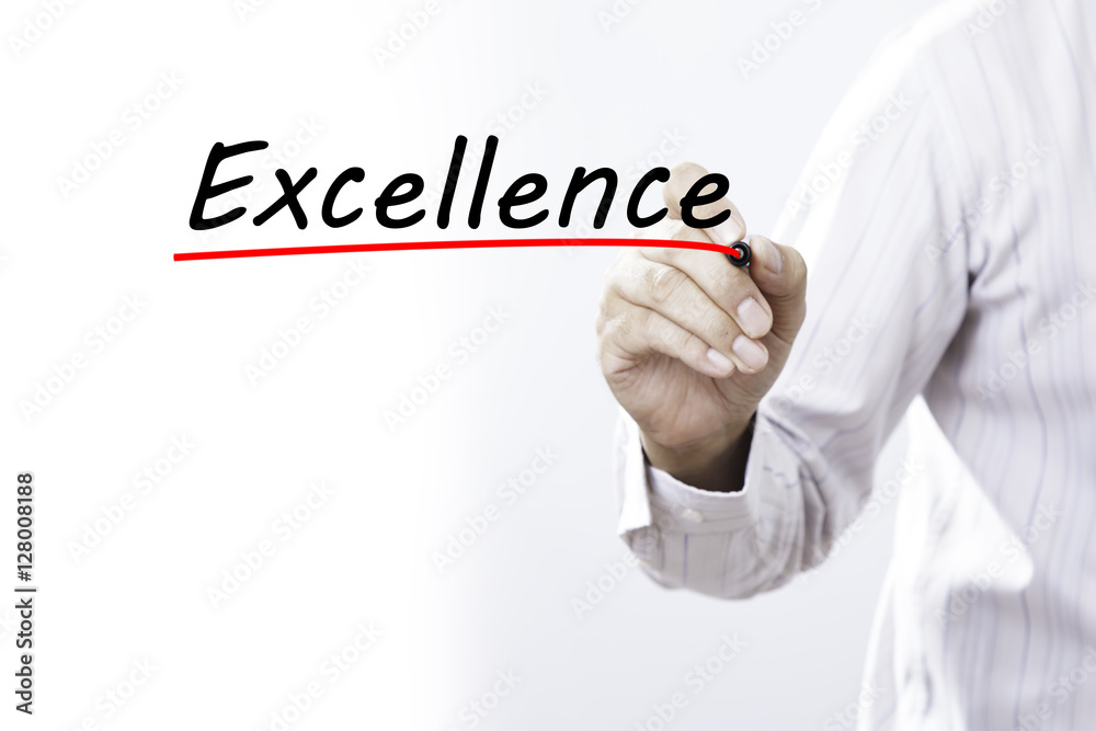 Businessman hand writing Excellence with marker, Business concep Businessman hand writing Excellence with marker, Business concep