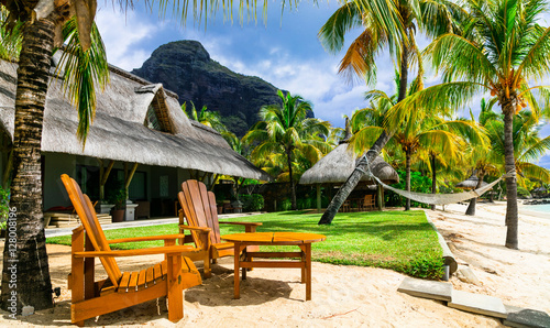 Fototapeta Naklejka Na Ścianę i Meble -  Relaxing luxury holidays with beach chairs and hammock. Mauritius