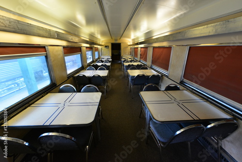 Th dining car on a vintage American railway carriage.