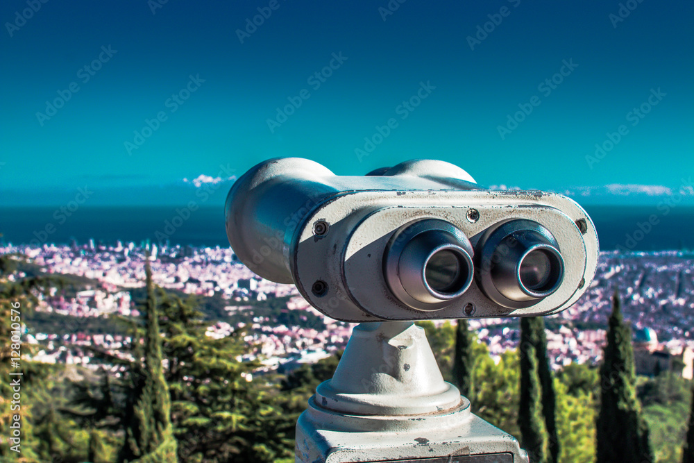 Barcelona, Spain. November 23, 2016 - Coin operated binoculars and panoramic view of the city