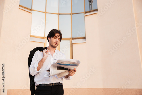 Man in shirt with newspaper