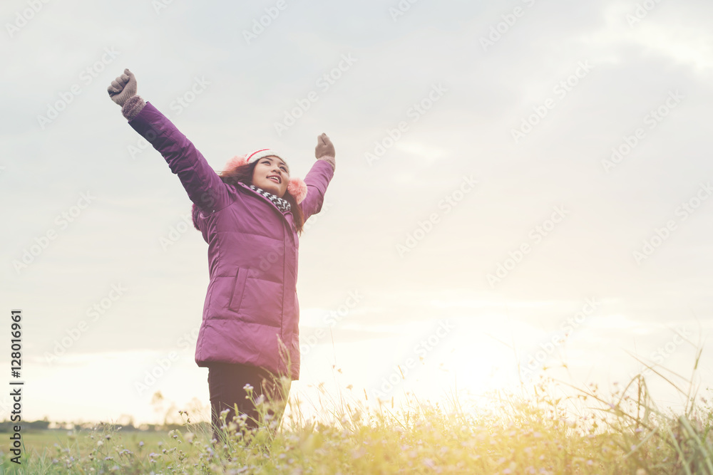 Young girl spreading hands and joy with nature while winter time Young girl spreading hands and joy with nature while winter time