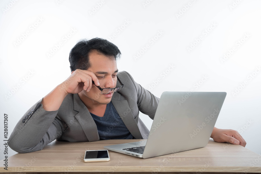 young businessman Stressful jobs using a laptop sitting thinking young businessman Stressful jobs using a laptop sitting thinking