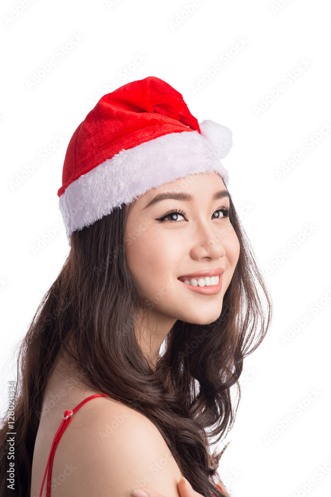 Christmas Woman. Beauty Asian Model Girl in Santa Hat isolated o Christmas Woman. Beauty Asian Model Girl in Santa Hat isolated o