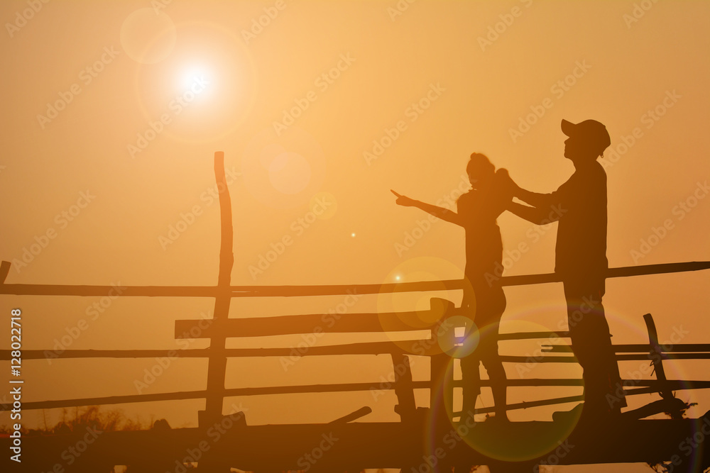 Silhouettes happy family playing at sunset. Concept father day