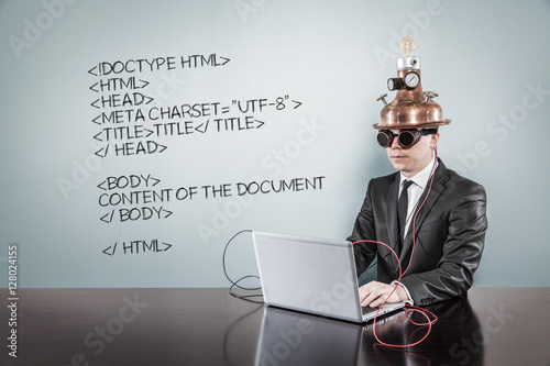 Photos Html code text with vintage businessman using laptop