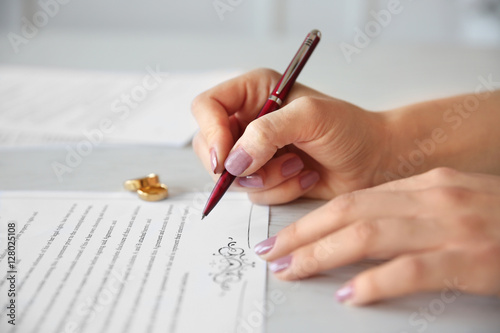 Woman signing marriage cont...