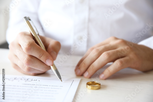 Man signing marriage contra...