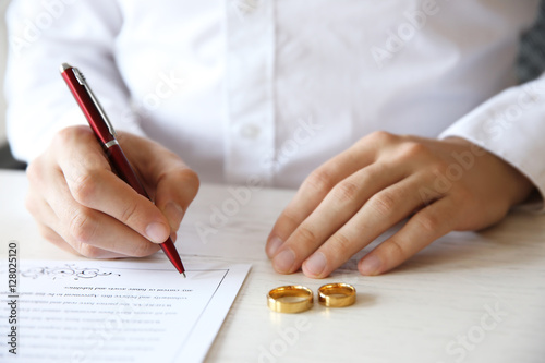 Man signing marriage contra...