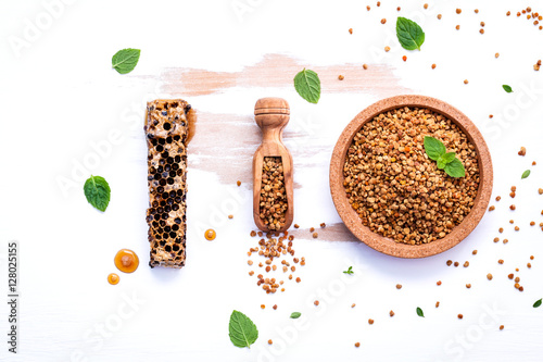 Raw organic bee pollen on shabby wooden board. Bee pollen granul