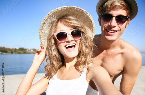 Happy couple taking selfie ...