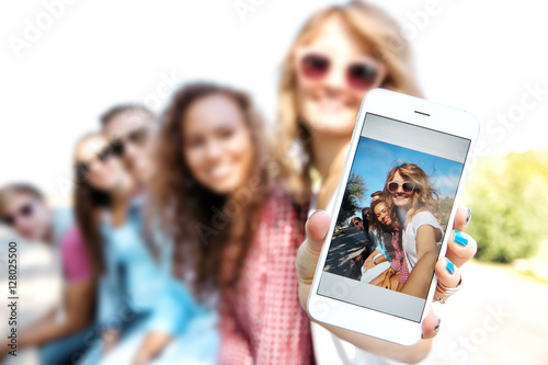 Happy friends taking selfie...