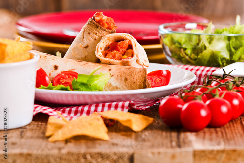 Tortilla wraps with chicken and vegetable.