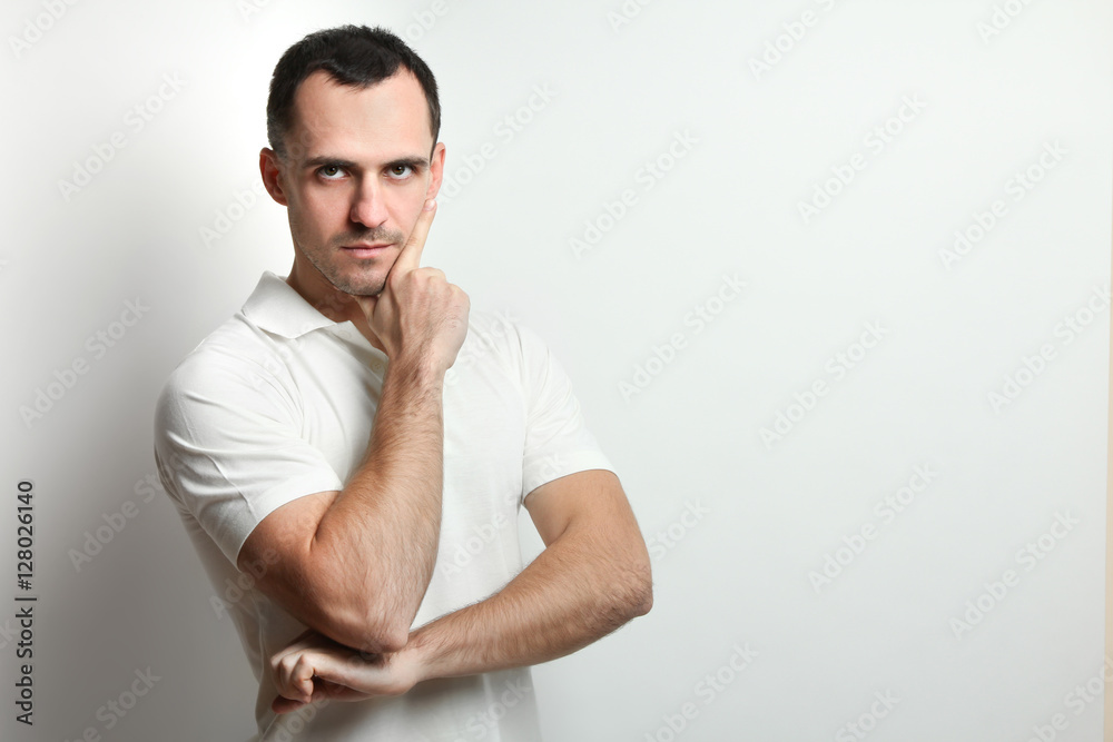Thoughtful, serious, young man posing on a white background. Thoughtful, serious, young man posing on a white background.