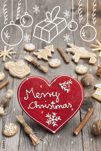 Christmas heart shaped gingerbread background. Winter holidays atmosphere. Snoflakes. Hand drawn ribbon for copy.Perfect for greeting cards, flyers, etc.