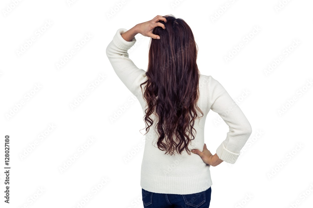 Rear view of brunette with hand on hair