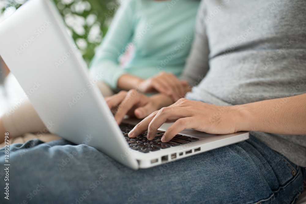 Young asian couple browsing internet at home,using laptop and sm Young asian couple browsing internet at home,using laptop and sm