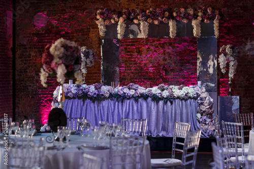 Look at violet dinner table standing under glass altar in the ha © nastasenko