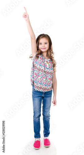 Cute little girl is pointing up isolated photo