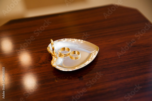 Wedding gold rings on the stand in registry office