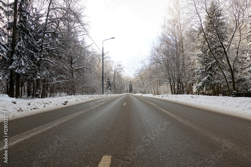 The road through the winter forest