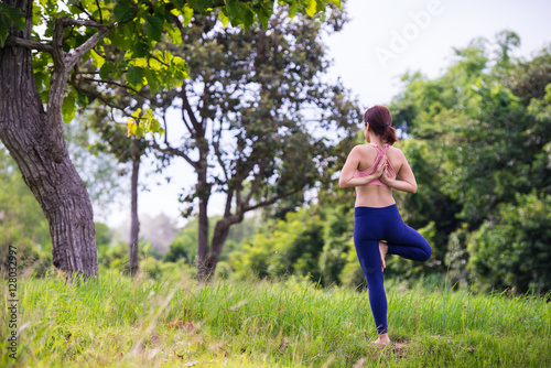 Young woman doing yoga.