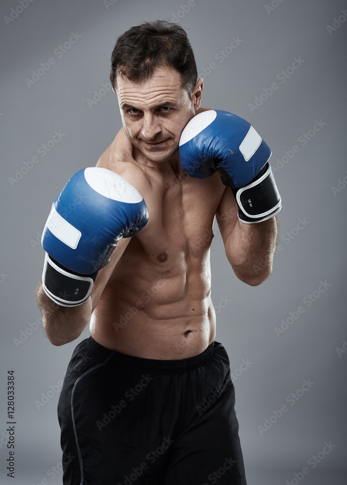 Kickbox fighter on gray background